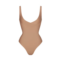 SKIMS BODY UNLINED PLUNGE THONG BODYSUIT | SIENNA