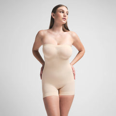 SEAMLESS SCULPT STRAPLESS SHORTIE BODYSUIT | SAND